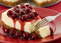 Cherry cheesecake slice with fork on plate Royalty Free Stock Photo