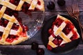 Slice of cherry pie close up on a rustic wood background Royalty Free Stock Photo