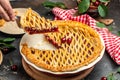 Slice of cherry pie, Flaky Crust, piece on a plate and the whole homemade cherry pie, top view Royalty Free Stock Photo