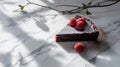 A slice of chocolate cake garnished with fresh raspberries on a marble surface Royalty Free Stock Photo