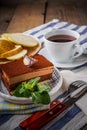 Chocolate cake and a cup of tea with lemon, and slices of pear, Royalty Free Stock Photo