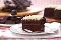 A slice of chocolate cake on a white plate. Royalty Free Stock Photo