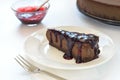 Slice of chocolate cheesecake on white plate Royalty Free Stock Photo