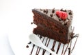 Slice of chocolate layer cake with strawberries Royalty Free Stock Photo