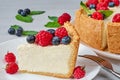 Slice of classic cheesecake with fresh berries on the white plate - healthy organic summer dessert. Cheese cake with blueberries Royalty Free Stock Photo