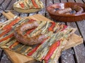 A slice of coca de recapte, a typical Catalan pizza-like savory pie, made with grilled aubergines and red pepper, and pork sausage