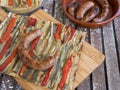 A slice of coca de recapte, a typical Catalan pizza-like savory pie, made with grilled aubergines and red pepper, and pork sausage