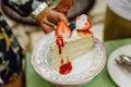 A Slice of Crape Cake on top with Mixed Berries and Strawberry Sauce