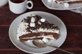 Slice of cream cake with marshmallow and chocolate