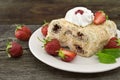 Slice of cream puff cake with strawberry on wooden table. Select Royalty Free Stock Photo