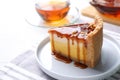 Slice of cake with caramel sauce on table Royalty Free Stock Photo