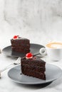 A slice of delicious chocolate cake with cherry on top on marble background. Piece of Cake on a Plate. Sweet food. Sweet dessert. Royalty Free Stock Photo