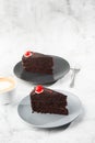 A slice of delicious chocolate cake with cherry on top on marble background. Piece of Cake on a Plate. Sweet food. Sweet Royalty Free Stock Photo