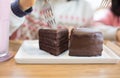 A slice of delicious chocolate cake. Piece of cake on a plate. Sweet food. Sweet dessert. Close up of birthday cake being eaten.