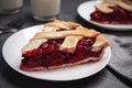 Slice of delicious fresh cherry pie on table, closeup Royalty Free Stock Photo