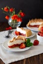 Slice of delicious strawberry tart with meringue on wooden background. Summer food. Soft focus Royalty Free Stock Photo