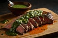 slice of flank steak with chimichurri sauce drizzle