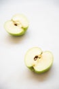 Slice of fresh apple green fruit on a white background. Healthy eating nutritious food Royalty Free Stock Photo