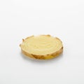 A slice of fresh ginger root Zingiber officinale is shown on a white surface Royalty Free Stock Photo