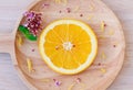 Slice fresh orange on wooden tray