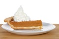 Slice of pumpkin pie with whipped cream piled high Royalty Free Stock Photo