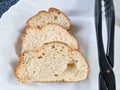 Slice of freshly cut bread on a white plate Royalty Free Stock Photo