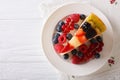 Slice of fruit jelly cake closeup on a plate. Horizontal top vie Royalty Free Stock Photo