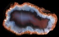 Slice of geode with red and blue chalcedony and red zeolite crystals on the periphery