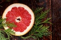 A Slice of Grapefruit on a wooden Background Royalty Free Stock Photo