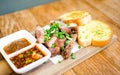 Slice Grilled pork with thai chilli sauce and garlic bread serve