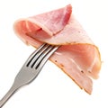 Slice of ham on a fork isolated on white Royalty Free Stock Photo