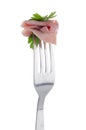 Slice of ham skewered on a fork