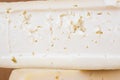 Slice of hard cheese, goat`s milk. Typical soft texture and whitish color. Farm homemade cheese. The concept of