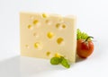 Slice of hard cheese and a tomato Royalty Free Stock Photo