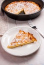 Slice of homemade apple pie with fork and fresh apples on light Royalty Free Stock Photo