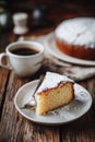 slice of homemade cake on white plate and cup of coffee Royalty Free Stock Photo