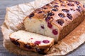 Slice of homemade cranberry cake with cherries on a wooden background Royalty Free Stock Photo