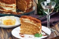 Slice of homemade layered honey cake with honeycomb and mint, traditional food of Jewish New Near. Sweet food
