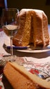 Slice of homemade pandoro with Christmas dish