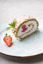 Slice of ice cream roll cake served with strawberry Royalty Free Stock Photo