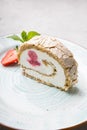 Slice of ice cream roll cake served with strawberry Royalty Free Stock Photo