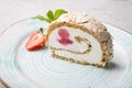 Slice of ice cream roll cake served with strawberry Royalty Free Stock Photo