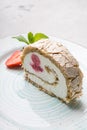 Slice of ice cream roll cake served with strawberry Royalty Free Stock Photo