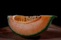 Slice of juicy melon on a wooden board Royalty Free Stock Photo