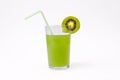 Slice of kiwi and glass of kiwi juice with straw