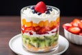 slice layered fruit salad in a dessert cup