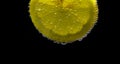 A slice of lemon with bubbles Royalty Free Stock Photo