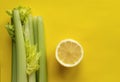 A slice of lemon and a bunch of celery
