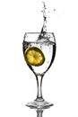 Slice of lemon dropped into the water Royalty Free Stock Photo