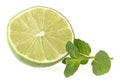 Slice of lime with fresh mint leaves isolated on white background Royalty Free Stock Photo